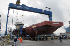 The 700 tonne navigation bridge of HMS Queen Elizabeth being  lowered into place at Rosyth Shipyard in Scotland. Photo: MoD