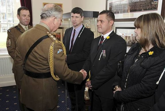 Drummer Dale Leach, who was injured in Afghanistan during the Battalion’s last tour, was presented with his Afghanistan medal by The Prince of Wales. Photo: Sgt. Steven Hughes, RLC/MoD