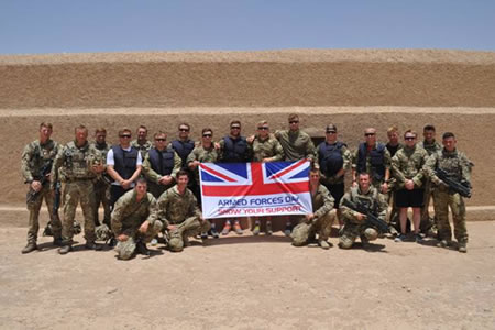 Rugby players of the Saracens senior squad and Gunners of 15 Sqn, RAF Regiment, fly the flag for Armed Forces Day. Photo: MoD.