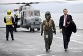 Picture shows SoS leaving the Lynx aircraft with HMS Montrose Flight Commander, Lt Rebecca Martin. HMS Bulwark hosts a Distinguished Visitors day for the British Secretary of State for Defence, Right Honourable Philip Hammond and the French Secretary of State for Defence, Source: MoD.